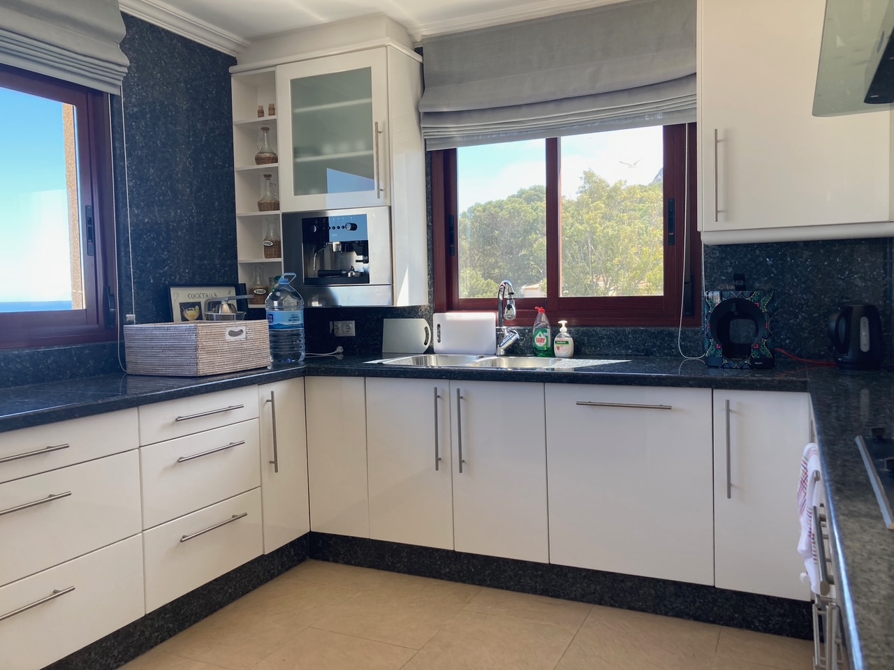 Kitchen with espresso machine and harbour view